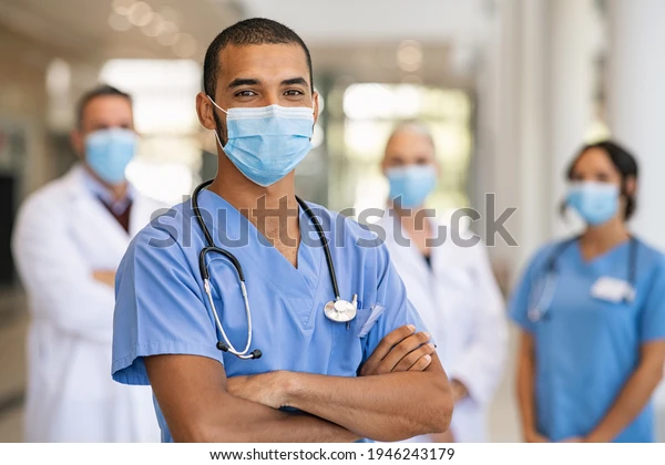 confident-multiethnic-male-nurse-front-600w-1946243179